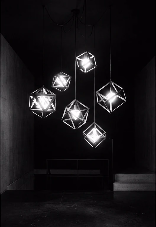 Geometric lamps hanging in a dark interior
